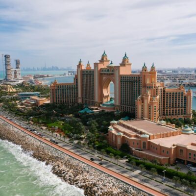 A breathtaking drone shot of Atlantis, The Palm resort in Dubai, highlighting the luxurious urban landscape.