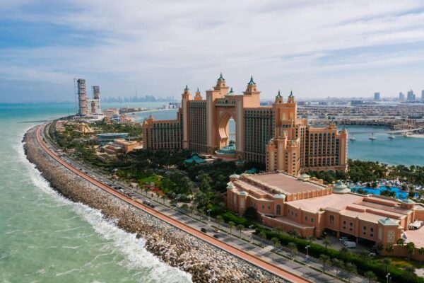 A breathtaking drone shot of Atlantis, The Palm resort in Dubai, highlighting the luxurious urban landscape.