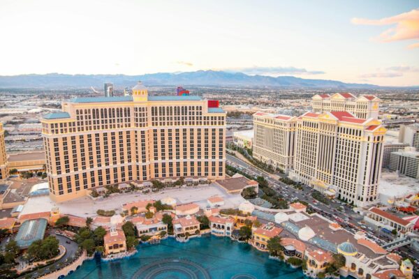 Captivating aerial photo of Las Vegas featuring iconic Bellagio and Caesar's Palace at sunset.